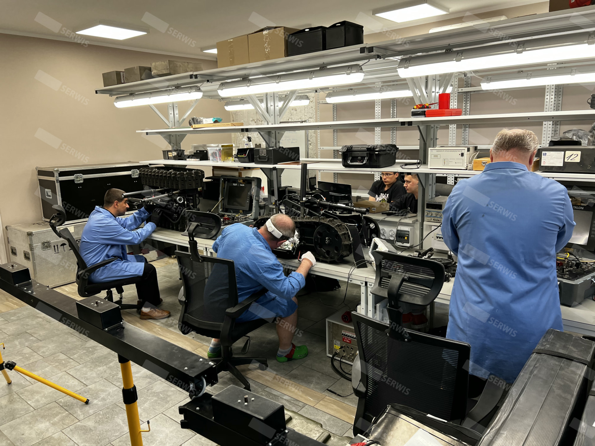 A&D Serwis lab — technicians servicing equipment